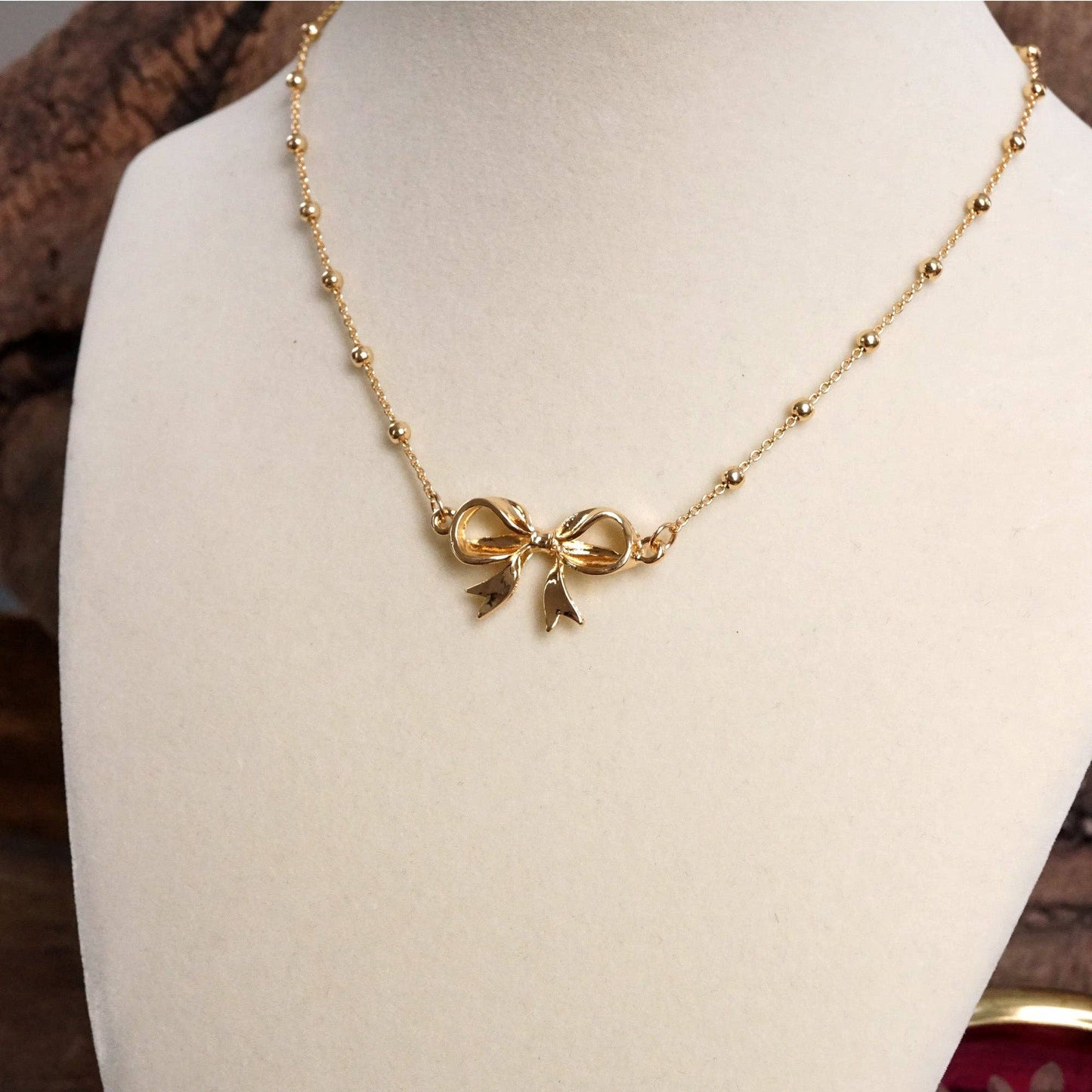 Fancy Bow Necklace - Short dainty station chain in gold tone