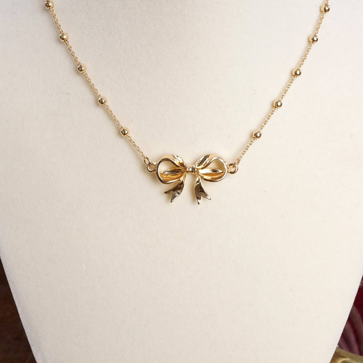 Fancy Bow Necklace - Short dainty station chain in gold tone