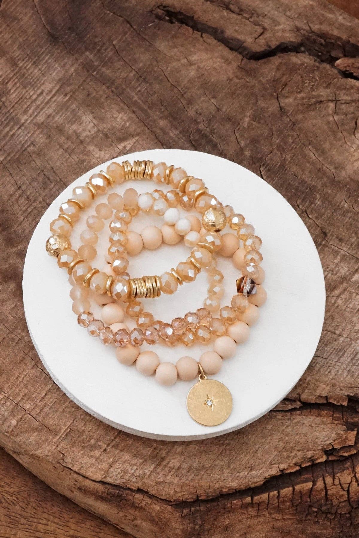 Beaded bracelets set in Neutral Ivory Cream with a coin charm